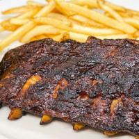 Half Bbq Ribs · Served with fries and corn the cob. Add baked potato instead of fries for an additional char...