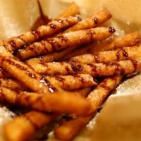 Funnel Fries · Served with chocolate or caramel dipping sauce.