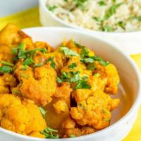 Alu Gobi · Fresh cauliflower and potatoes steamed with onions, fresh tomatoes and spices.