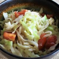 Stir-Fried Cabbage With Tomato · Stir fried with a lite garlic soy sauce.
