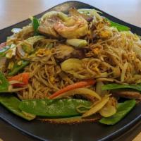 Singapore Noodles · Stir fried rice vermicelli noodles with egg, roasted pork, shrimp, lime juice infused vegeta...