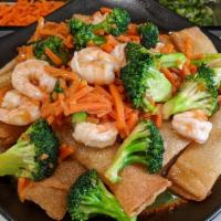 Lad Nar Noodle · Stir-fried broccoli and carrots simmered in a ginger sauce. Served over crispy, wide rice no...