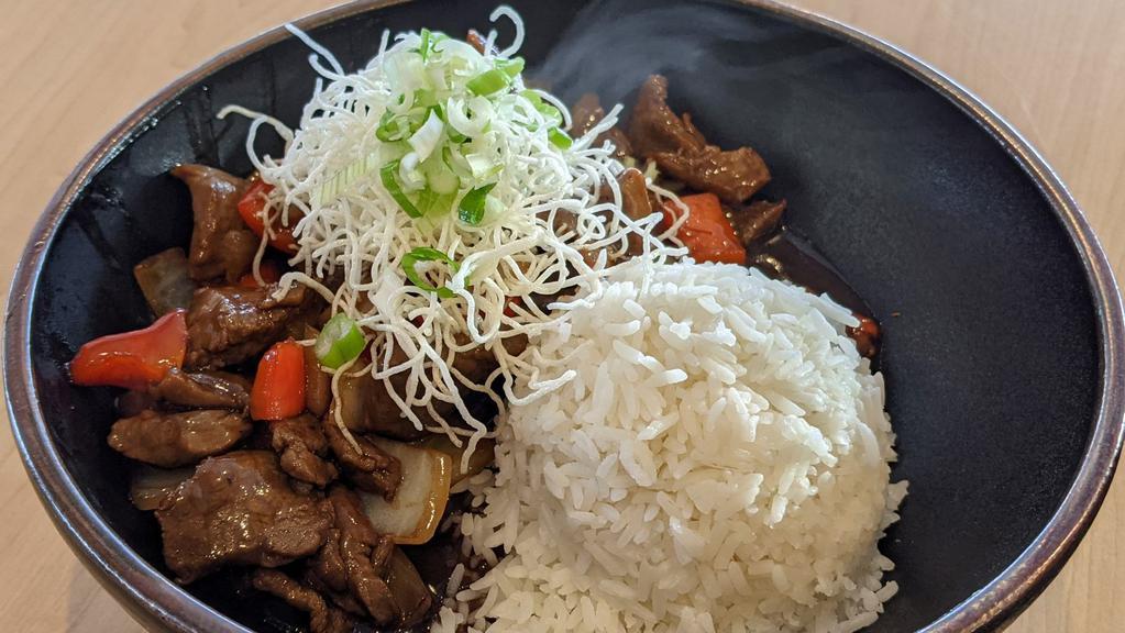 Pepper Beef Rice Platter · Red bell pepper, onions and beef stir-fried in a thick sweet soy sauce.  Includes a side of rice garnished with crunchy vermicelli noodles and green onions.