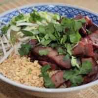 Egg Noodles With Roasted Pork · Sliced tender Asian style roasted pork served over egg noodles and garnished with bean sprou...