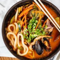 Spicy Seafood Udon · Flour noodles with mussels, shrimp, squid, and veggies with spicy pepper. Available with non...