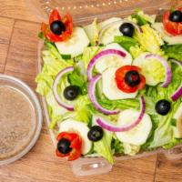 Italian Salad · Romaine lettuce, cucumbers, tomatoes, onions, black olives, and homemade dressing.