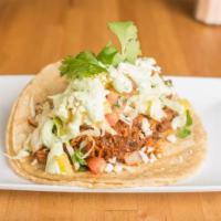 Al Pastor Folded · Tender guajillo chili marinated pork, fresh pineapple pico, our signature S&F slaw, queso fr...