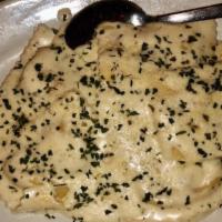 Homemade Lobster Ravioli · Stuffed with fresh lobster meat and topped with alfredo sauce, parmesan cheese and a sprinkl...
