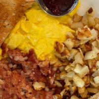 Corned Beef Hash & Eggs · Served with two eggs, breakfast potatoes and toast.