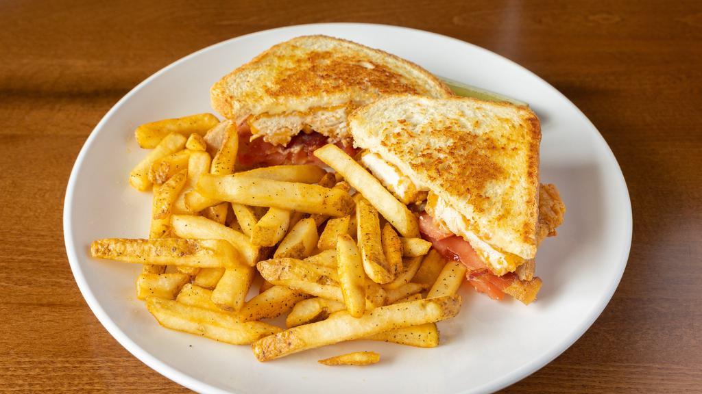 Chicken Tender Melt · chicken tenders, bacon, tomato, and swiss cheese on grilled sourdough.