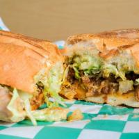 Torta · Mexican style sandwich, choice of meat with beans, lettuce, tomato, sour cream & cheese. Add...