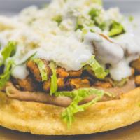 Sopes · Thick fried cornmeal shell topped with choice of meat, beans, lettuce, tomato, cheese, and s...