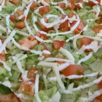 Salad Pizza · Mozzarella cheese, green peppers and onions. Topped with lettuce, tomatoes, and homemade ran...