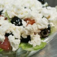 Greek · Tomatoes, onions, black olives, and feta cheese.