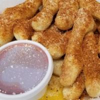 Cajun Stix · Breadstix topped with butter, garlic, parmesan cheese, and cajun season. Served with homemad...