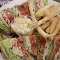 Turkey Club House · Triple decker sandwich of turkey, tomatoes, lettuce, bacon and mayonnaise.