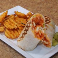 Buffalo Chicken Wrap* · Crispy or grilled chicken tossed in hot and spicy sauce, diced tomatoes, shredded lettuce, j...