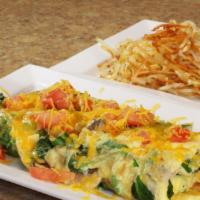 Veggie Omelette · Onions, green peppers, mushrooms, tomatoes, spinach, and cheddar cheese.