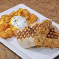 Breakfast Burrito · Eggs scrambled with your choice of chorizo, barbacoa beef, bacon, sausage, or ham, onions, t...