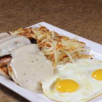 Biscuits, Gravy, & Eggs* · 2 eggs, sausage links, hash browns, 2 buttermilk biscuits smothered in country gravy.