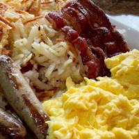 Crepe Breakfast* · 2 eggs, 2 bacon strips, 2 sausage links, hash browns, and 2 any style crepes: