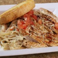 Chicken Alfredo Pasta* · Grilled seasoned chicken, fettuccine pasta, alfredo sauce, spinach, and mushrooms, topped wi...