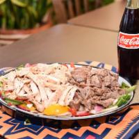 Fajitas · Grilled chicken sauteed or grilled steak with onions and peppers. Served with guacamole and ...