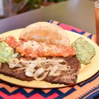 Tampiquena · Grilled steak topped with grilled onions. Served with cheese, ground beef corn taco, guacamo...