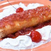 Strawberry Cheesecake Chimichanga · Drizzled with fresh strawberry topping.