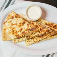 Quesadillas · Corn or flour tortilla grilled to crisp stuffed with cheese and choice of meat.
