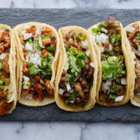 2 Carne Asada Tacos · Includes rice and beans. Guacamole and pico on the tacos.
