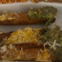 Rolled Tacos · Includes rice and beans. 4 roll tacos with shredded beef guacamole and cheese.