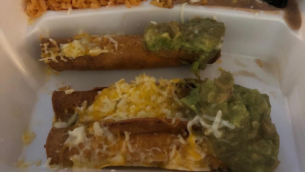 Rolled Tacos · Includes rice and beans. 4 roll tacos with shredded beef guacamole and cheese.