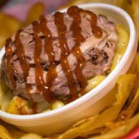 Loaded Q-Chips · Deep- fried potato chips piled high with pork and beans. topped with cheese and sour cream.