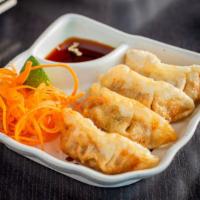 Pot Sticker (Gyoza) · Fried or Steamed pot sticker stuffed with pork and vegetable served with dipping sauce.
