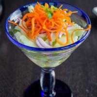 Cucumber Salad · Sliced cucumber, carrot  dressing with Thai vinaigrette.
