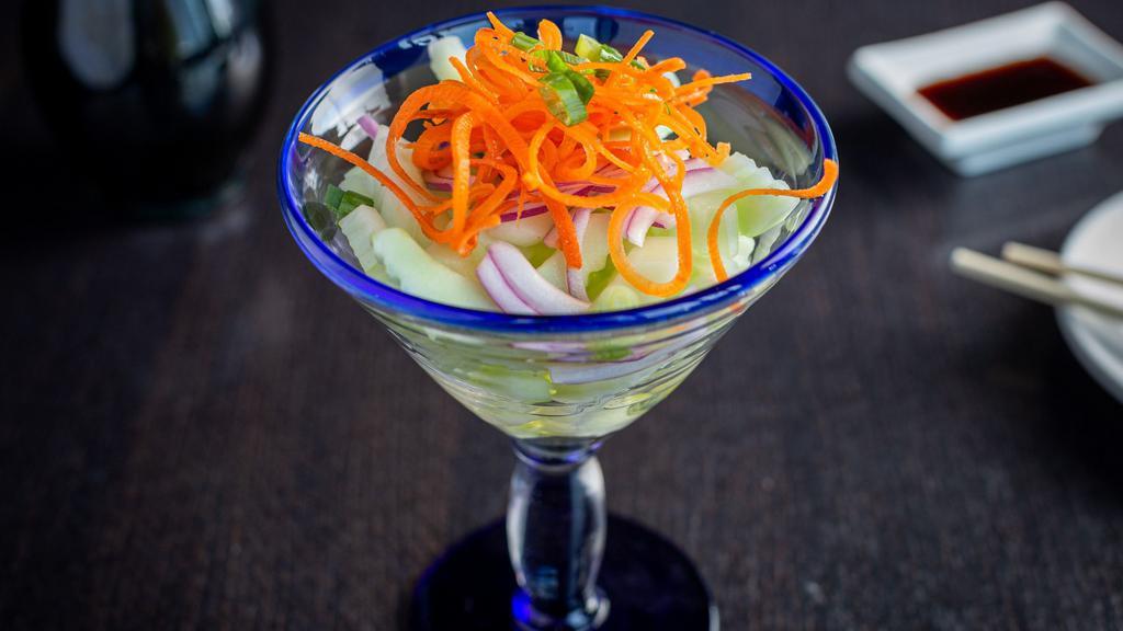 Cucumber Salad · Sliced cucumber, carrot  dressing with Thai vinaigrette.