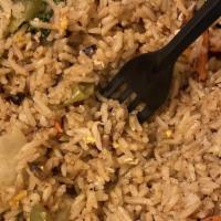 Fried Rice · Stir fried rice, egg, onions, scallions, garlic, carrots with your choice of meat.