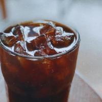Iced Americano · Double shot of espresso poured into water