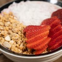 Strawberry Fields · Smoothie bowl with strawberries, vanilla & almond milk. Topped w/ granola, strawberries & co...