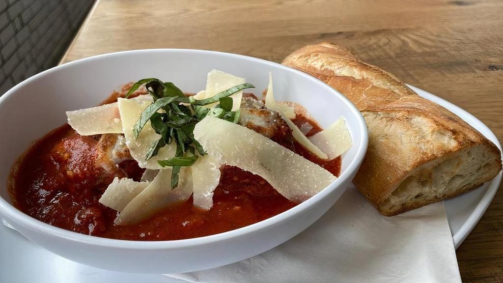 Meatballs · One Half Pound of Housemade Meatballs topped with Marinara Sauce and Melted Mozzarella Cheese and finished with Shaved Parmesan. Served with baked Italian Bread