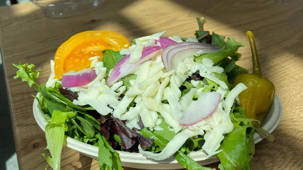 Small House Salad · Our salad is a fresh blend of European lettuces. We add heirloom tomatoes, pepperoncini, mozzarella, and fresh red onion. Served with your choice of dressing.