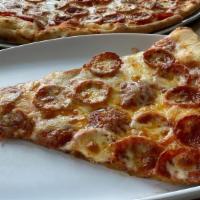 Pepperoni Slice · Specialty blend of locally made Ezzo Pepperoni covered in 100% whole milk Mozzarella Cheese ...