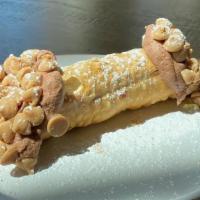 Buckeye Cannoli · Cannoli shell filled with our Housemade Chocolate Cannoli Cream and capped with Peanut Butte...