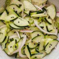 Cucumber Salad · Cucumber, Red Onion, Rice Vinegar, Salt, Scallion, Sesame Seed