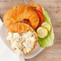 Chicken Salad Sandwich · Fresh chicken salad on a croissant, served with lettuce, tomato, and pickle.