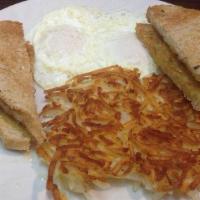 Two Eggs Any Style · Two eggs with options for meat potatoes and toast.