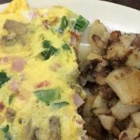 Create Your Own Omelette · Three egg omelet. With potatoes and toast.