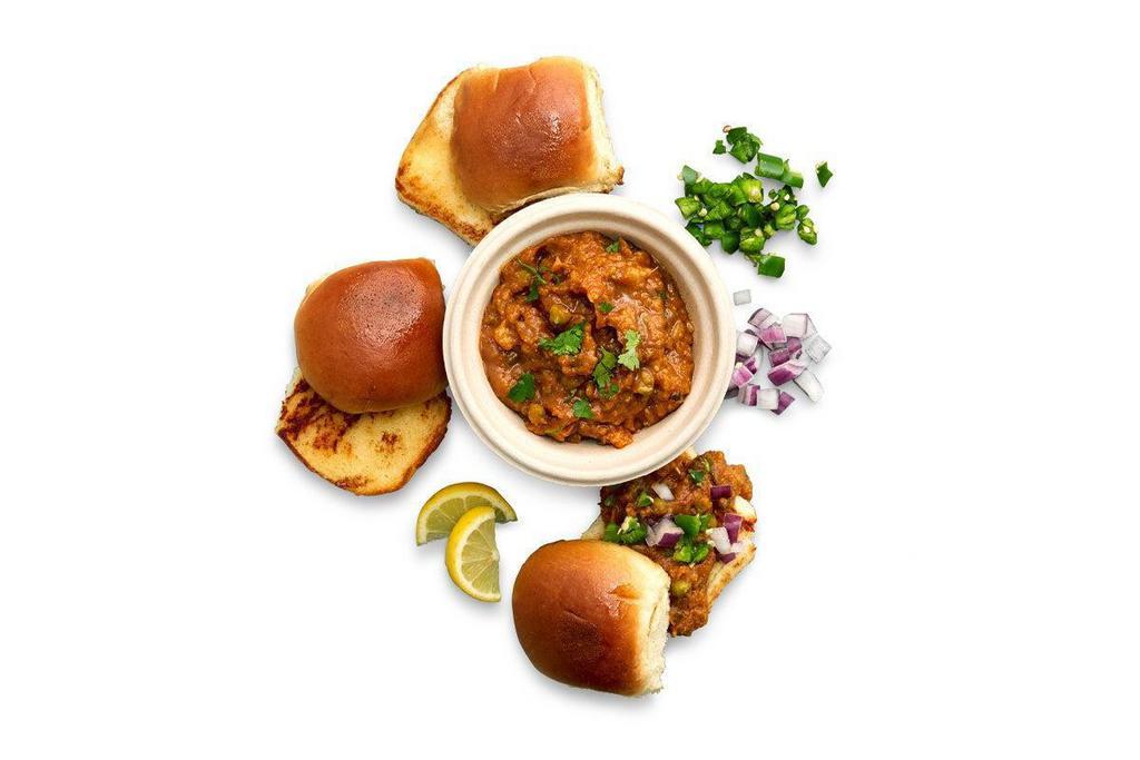 Pav Bhaji · An all-time favorite street snack. It’s kinda like an Indian version of a veggie sloppy joe. A flavorful bowl of bhaji vegetables served with fresh-baked, lightly buttered, toasted buns (V).