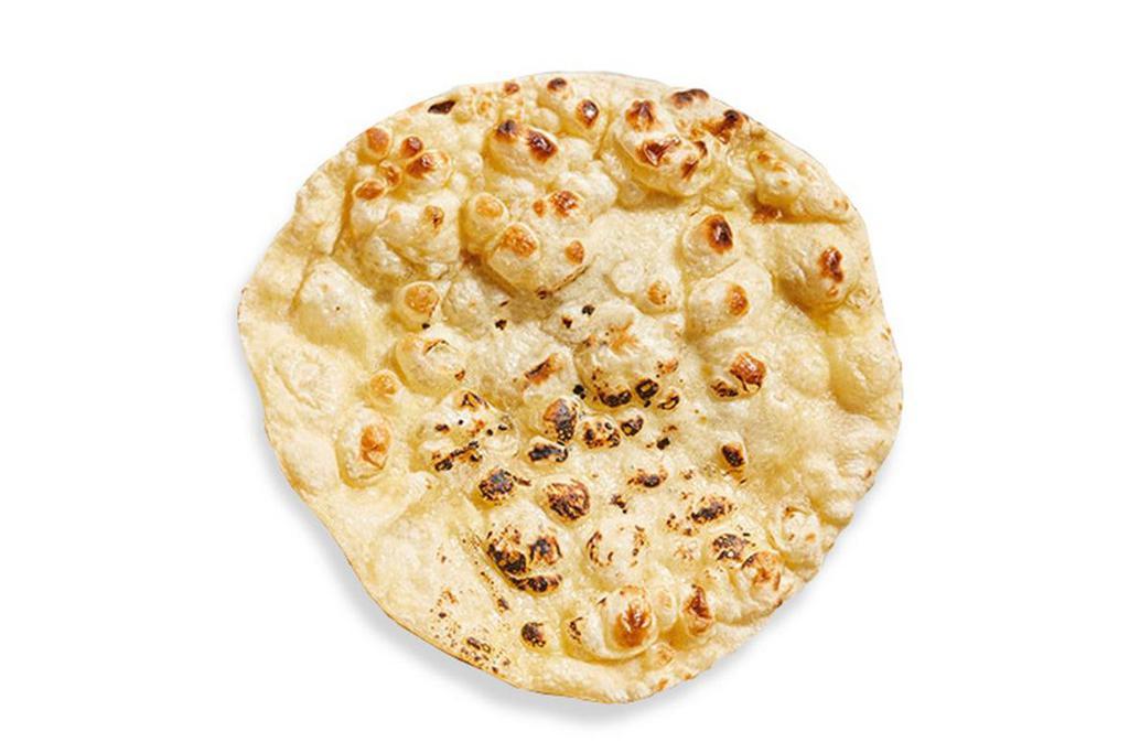 Naan · Freshly baked in our tandoor ovens, lightly brushed with butter and sprinkled with kosher salt. (V)